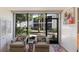 Cozy sitting area with armchairs and outdoor view at 5623 Midnight Pass Rd # 615, Sarasota, FL 34242