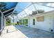 Spacious screened-in lanai with ample room for outdoor entertaining and views of the house at 5812 Garden Lakes Fern, Bradenton, FL 34203