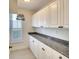 Pantry with granite countertops, white cabinets, and a window to allow for natural light at 5812 Garden Lakes Fern, Bradenton, FL 34203