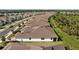 Aerial view of a residential neighborhood with well-maintained homes and green spaces at 5816 Mezzana Run, Palmetto, FL 34221