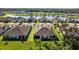 An aerial view of the neighborhood featuring a serene pond at 5816 Mezzana Run, Palmetto, FL 34221