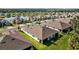 Aerial view of houses in the neighborhood near a pond at 5816 Mezzana Run, Palmetto, FL 34221