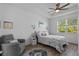 Serene bedroom with tray ceiling, ceiling fan, and natural light at 5816 Mezzana Run, Palmetto, FL 34221