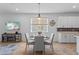 Cozy dining area with stylish decor, natural light, and adjacent kitchen features at 5816 Mezzana Run, Palmetto, FL 34221