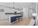 Modern kitchen with stainless appliances, ample cabinet space, and center island at 5816 Mezzana Run, Palmetto, FL 34221