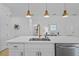 This kitchen features a large island with sink, ample counter space and pendant lights overhead at 5816 Mezzana Run, Palmetto, FL 34221