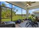 Relaxing screened lanai with serene views of the backyard, landscaping, and water at 5816 Mezzana Run, Palmetto, FL 34221