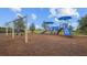 Community playground with swings, slides and other features for outdoor fun at 5816 Mezzana Run, Palmetto, FL 34221