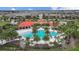 Overhead view of the luxurious community pool, complete with palm trees and elegant lounge areas at 5816 Mezzana Run, Palmetto, FL 34221