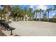 Splash pad area surrounded by tropical palm trees providing outdoor water fun at 5816 Mezzana Run, Palmetto, FL 34221