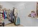 Organized walk-in closet featuring shelving and hanging space for clothing and storage at 5816 Mezzana Run, Palmetto, FL 34221
