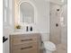 Modern bathroom with a stylish vanity, sleek mirror, and glass-enclosed shower, creating a spa-like experience at 5900 6Th S Way, St Petersburg, FL 33705