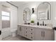 Bathroom showcasing double vanity with marble counters and modern matte black finishes at 5900 6Th S Way, St Petersburg, FL 33705