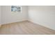 Bedroom with hardwood flooring and natural light from the window at 5900 6Th S Way, St Petersburg, FL 33705
