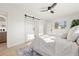 Bright bedroom featuring a modern sliding door and fresh decor, maximizing space and light at 5900 6Th S Way, St Petersburg, FL 33705
