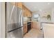 Bright kitchen featuring stainless steel appliances, light wood cabinets, and modern fixtures for a sleek look at 5900 6Th S Way, St Petersburg, FL 33705