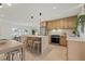 Modern open-concept kitchen with an island, stainless steel appliances, and a seamless flow into the dining and living areas at 5900 6Th S Way, St Petersburg, FL 33705