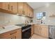 Well-lit kitchen showcasing a cooktop, modern cabinetry, and stainless steel appliances for a modern culinary space at 5900 6Th S Way, St Petersburg, FL 33705