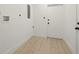 Laundry room featuring a utility sink and access to the exterior of the home at 5900 6Th S Way, St Petersburg, FL 33705
