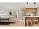 Open-concept living room and kitchen, featuring modern finishes and stainless steel appliances at 5900 6Th S Way, St Petersburg, FL 33705