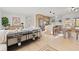 Bright living room with modern decor open to the kitchen and dining area, showcasing a stylish open floor plan at 5900 6Th S Way, St Petersburg, FL 33705