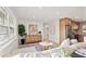 Bright living room with large windows, stylish decor, and open access to the modern kitchen at 5900 6Th S Way, St Petersburg, FL 33705