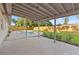 Outdoor patio area with view of fenced in pool and grassy backyard at 5900 6Th S Way, St Petersburg, FL 33705