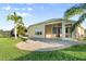 Lovely backyard featuring a patio area, well-maintained lawn, and mature trees, perfect for entertaining and outdoor living at 5902 106Th E Ter, Parrish, FL 34219