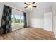 Bright bedroom with wood floors and big windows overlooking the lake at 5902 106Th E Ter, Parrish, FL 34219