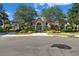 Attractive community clubhouse featuring stone accents, manicured landscaping, and a welcoming entrance at 5902 106Th E Ter, Parrish, FL 34219