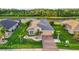 Well-maintained house with an attached garage, landscaping, and a lake view, creating great curb appeal at 5902 106Th E Ter, Parrish, FL 34219