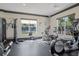 Well-equipped gym featuring weight machines, cardio equipment, and natural light at 5902 106Th E Ter, Parrish, FL 34219