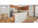 Bright kitchen features stainless steel appliances, wood cabinets, and stone countertops at 5902 106Th E Ter, Parrish, FL 34219