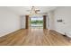 Empty Living Room with wood floors and large windows overlooking the lake and patio at 5902 106Th E Ter, Parrish, FL 34219