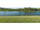 Scenic view of backyard pond with verdant green space perfect for relaxation and enjoyment at 5902 106Th E Ter, Parrish, FL 34219
