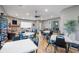 Well-lit recreation room with ping pong table, stone fireplace, and multiple seating areas at 5902 106Th E Ter, Parrish, FL 34219