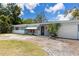 Charming single-story home with a light blue exterior, well-maintained lawn, and inviting curb appeal at 5916 Gulfport S Blvd, Gulfport, FL 33707