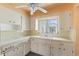 Charming kitchen featuring tile countertops, cabinets, and a vintage-style ceiling fan at 5916 Gulfport S Blvd, Gulfport, FL 33707