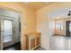 Open concept kitchen with wooden cabinet, beige walls, access to dining and outdoors at 5916 Gulfport S Blvd, Gulfport, FL 33707
