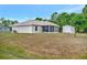 Exterior view of the screened lanai and shed in the backyard at 6104 Plamendon Ave, North Port, FL 34291