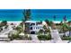 Beautiful modern home with lush landscaping and tropical views near a picturesque beach at 6381 Gulf Of Mexico Dr, Longboat Key, FL 34228