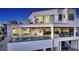 A luxurious home featuring an infinity pool, outdoor lounge, and multiple balconies at 6381 Gulf Of Mexico Dr, Longboat Key, FL 34228