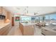 Open concept living room with views of the beach featuring an island, living room and sliding glass doors at 6381 Gulf Of Mexico Dr, Longboat Key, FL 34228