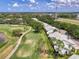 Aerial view of the neighborhood, showcasing condos lining the golf course at 6546 Fairway Gardens Dr # 6546, Bradenton, FL 34203