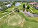 Overhead view of golf course showing the various lakes, landscaping, and surrounding neighborhood at 6546 Fairway Gardens Dr # 6546, Bradenton, FL 34203
