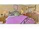 Primary bedroom with matching dressers and lamps, ceiling fan, and floral bedding accents at 6546 Fairway Gardens Dr # 6546, Bradenton, FL 34203