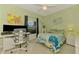 Bright bedroom with a desk area, a window view, and a cheerful, colorful decor at 6546 Fairway Gardens Dr # 6546, Bradenton, FL 34203