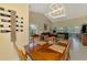 Bright dining area with a light fixture, wine rack, and natural light; ideal for hosting gatherings at 6546 Fairway Gardens Dr # 6546, Bradenton, FL 34203