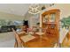 Charming dining room adjoining the living space, showcasing a large wooden table and natural lighting at 6546 Fairway Gardens Dr # 6546, Bradenton, FL 34203