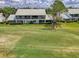 Beautiful building exterior showing lawn, a tiled roof and dual-story balconies at 6546 Fairway Gardens Dr # 6546, Bradenton, FL 34203